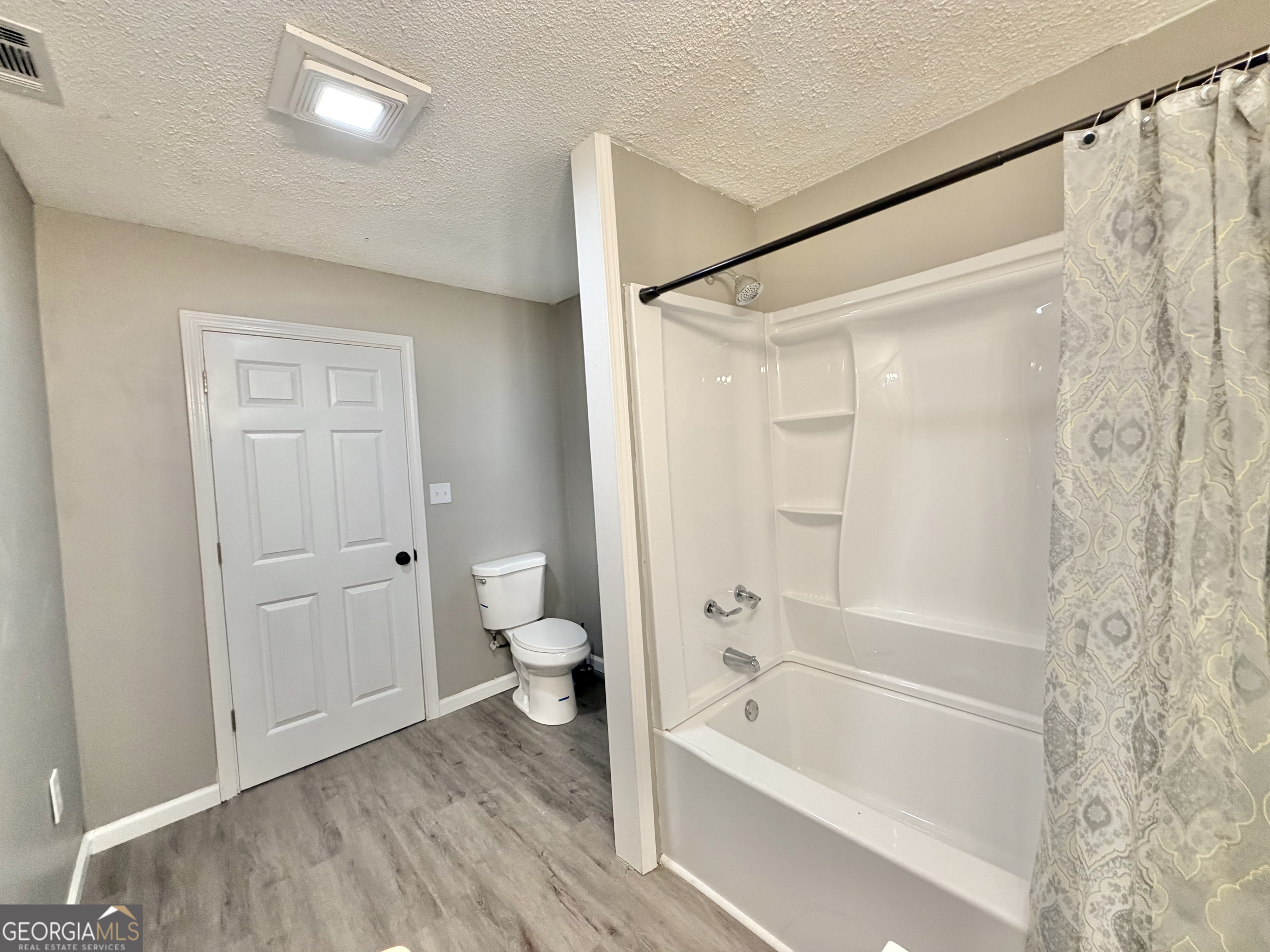 10 Busha Street Toccoa, GA 30577 - Photo 10 of 33 a bathroom with a bathtub and a shower