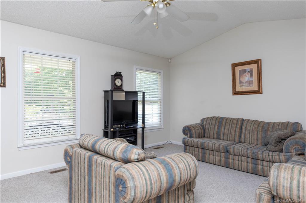 1007 Field Swallow Way, Unit 69 Clover, SC 29710 - Photo 2 of 18 a living room with furniture ceiling fan and a window