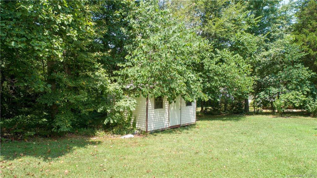 1007 Field Swallow Way, Unit 69 Clover, SC 29710 - Photo 17 of 18 a backyard of a house with lots of green space and fountain