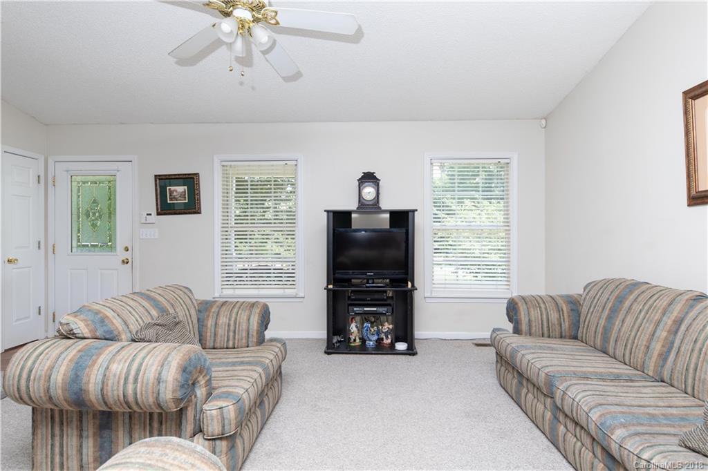 1007 Field Swallow Way, Unit 69 Clover, SC 29710 - Photo 3 of 18 a living room with furniture and a flat screen tv