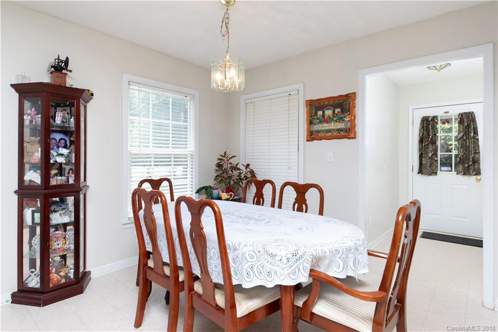 1007 Field Swallow Way, Unit 69 Clover, SC 29710 - Photo 4 of 18 a view of a dining room with furniture window and wooden floor