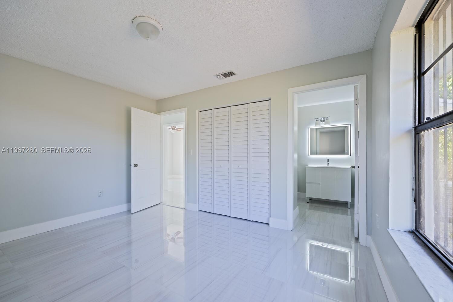 522 Southwest 3rd Avenue Homestead, FL 33030 - Photo 11 of 20 wooden floor and closet in a room
