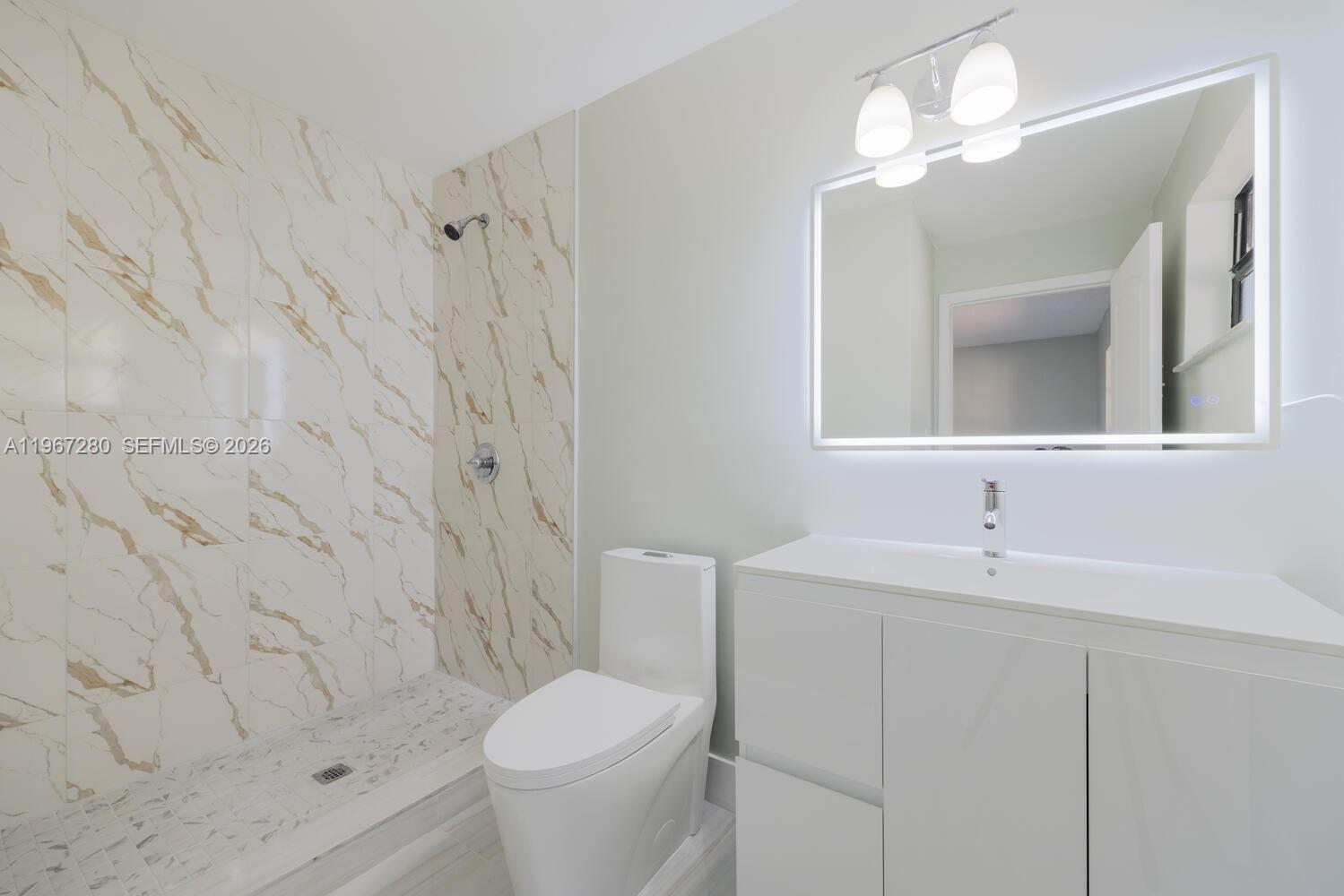 522 Southwest 3rd Avenue Homestead, FL 33030 - Photo 12 of 20 a bathroom with a sink a toilet and shower