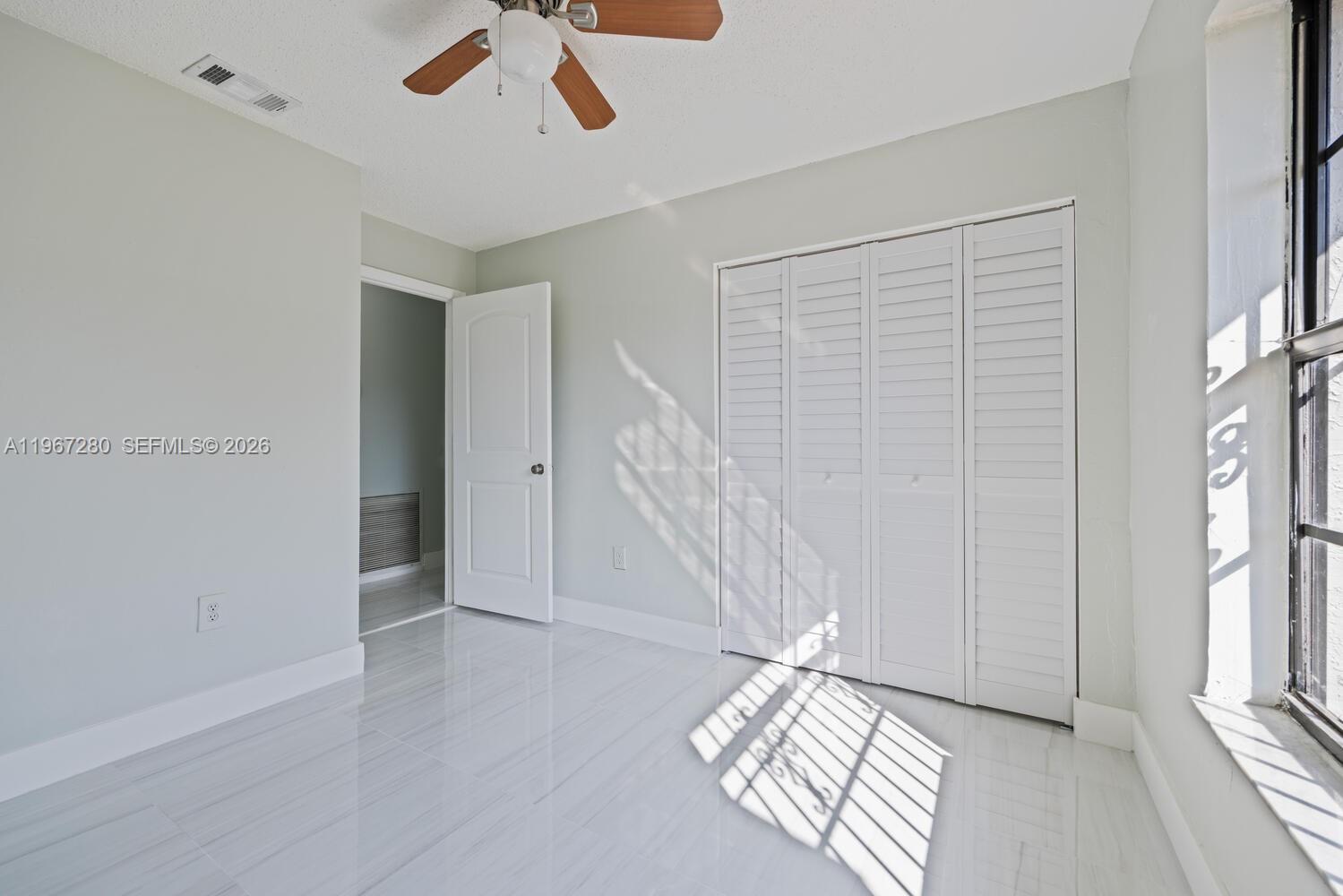 522 Southwest 3rd Avenue Homestead, FL 33030 - Photo 14 of 20 a view of entryway with stairs and wooden floor