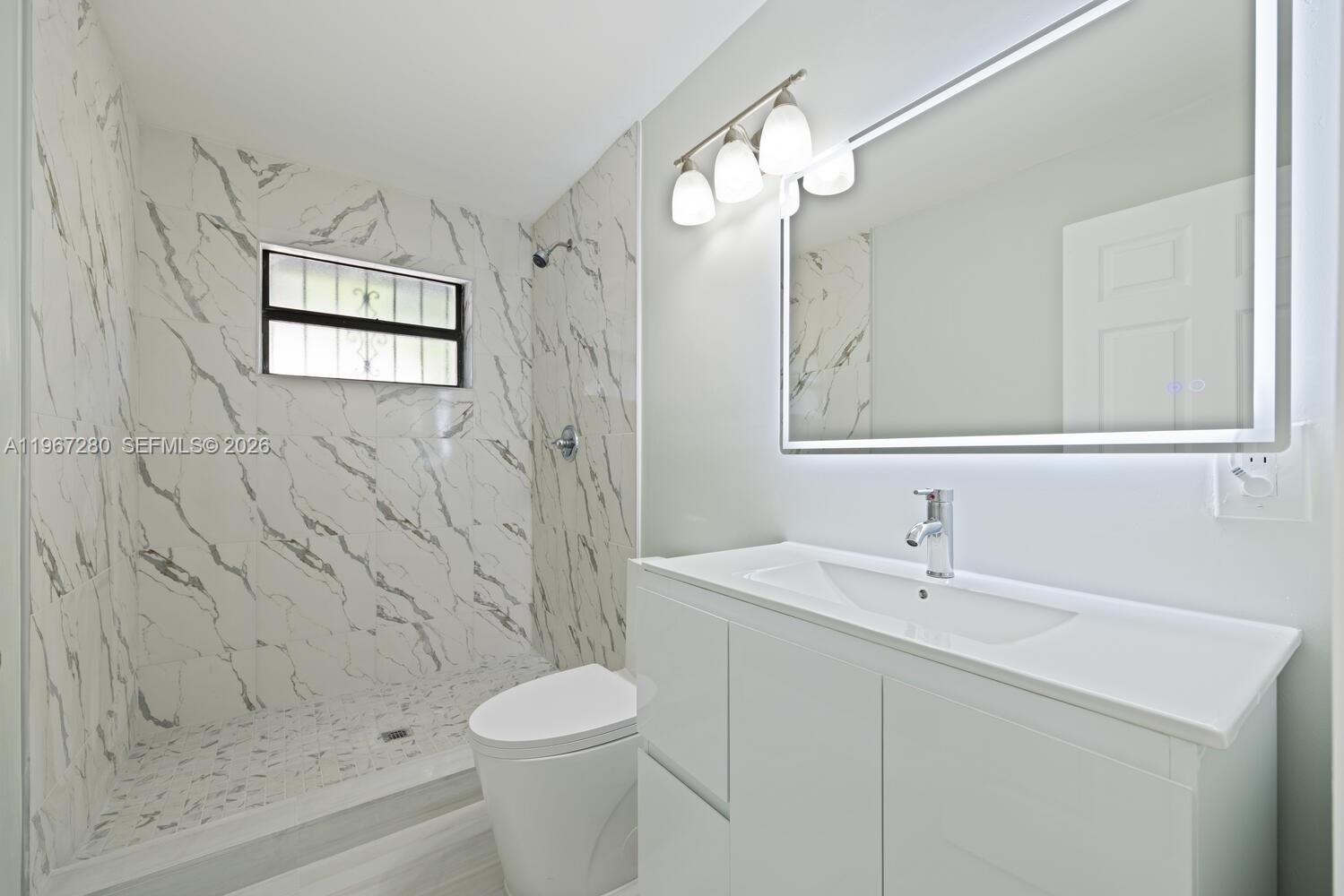 522 Southwest 3rd Avenue Homestead, FL 33030 - Photo 15 of 20 a bathroom with a sink a toilet and shower