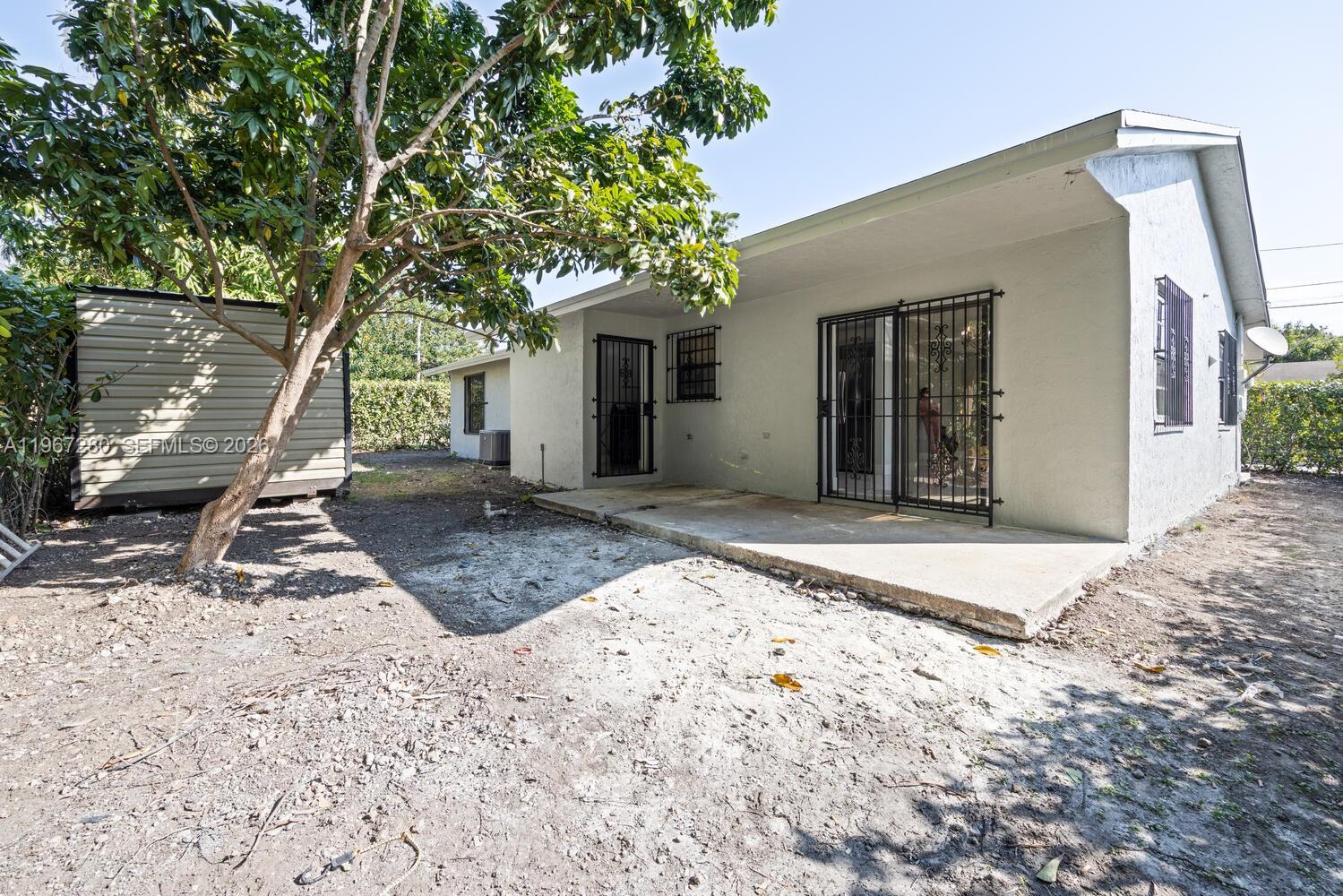 522 Southwest 3rd Avenue Homestead, FL 33030 - Photo 20 of 20 a view of a backyard with a tree