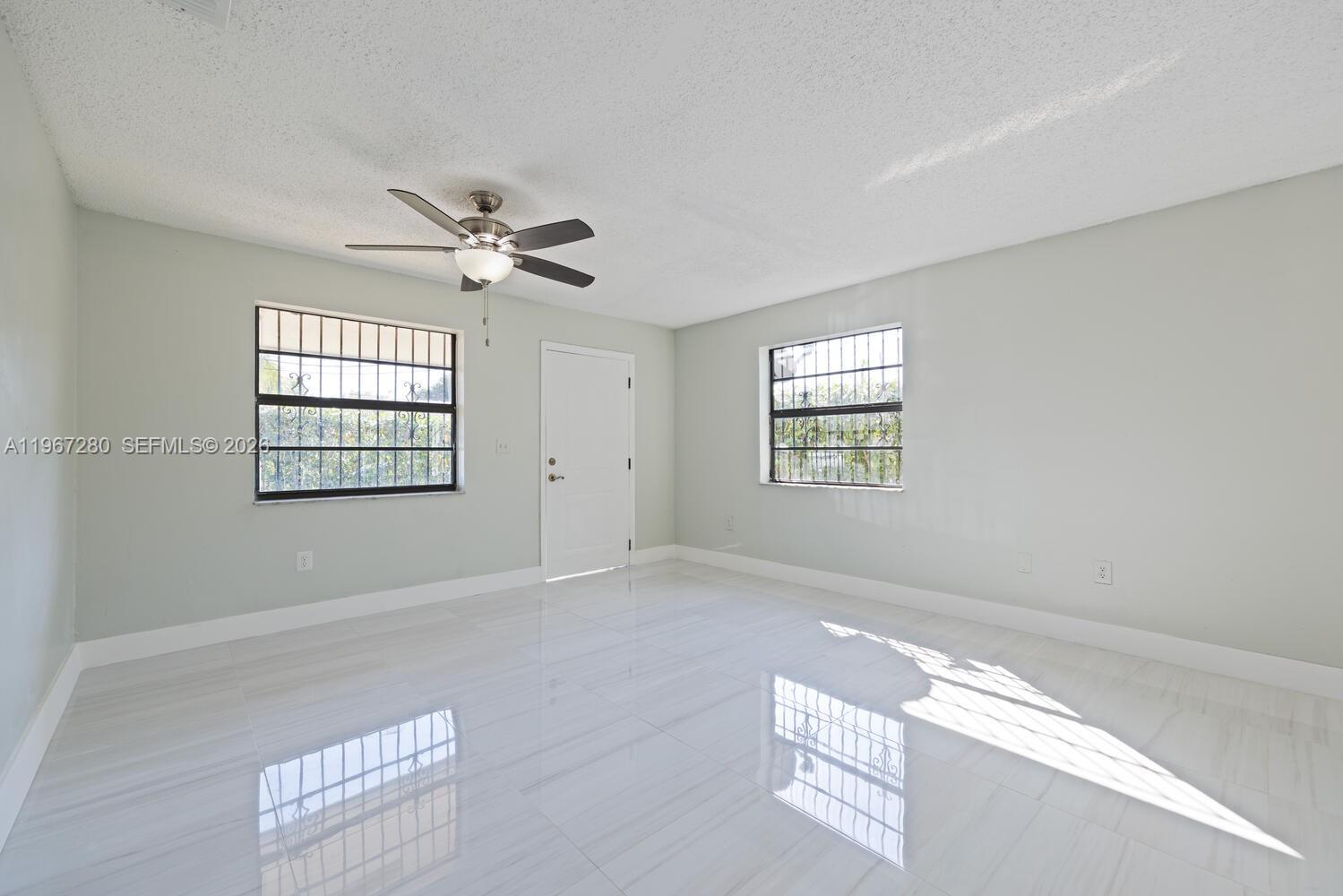 522 Southwest 3rd Avenue Homestead, FL 33030 - Photo 5 of 20 a view of an empty room with windows