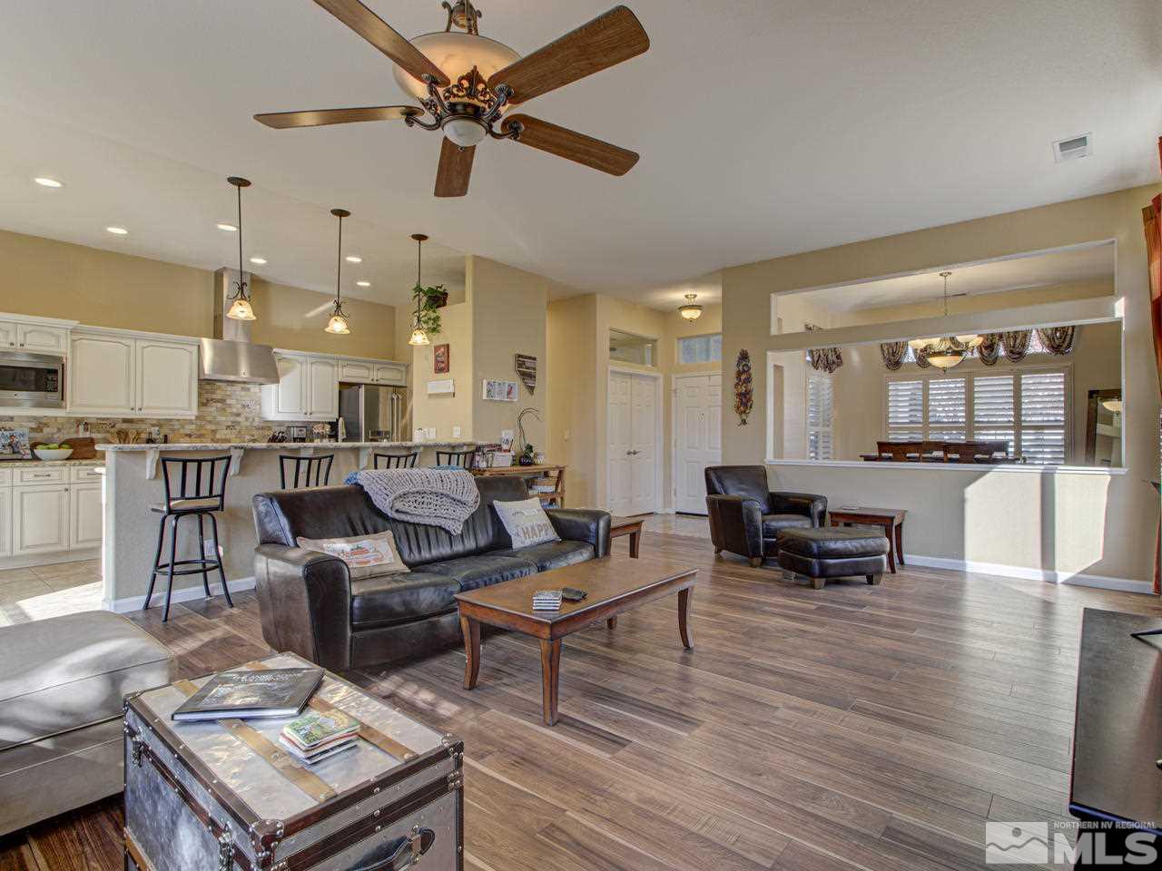 1870 Beringer Way Reno, NV 89521 - Photo 3 of 25 a living room with furniture kitchen view and a wooden floor