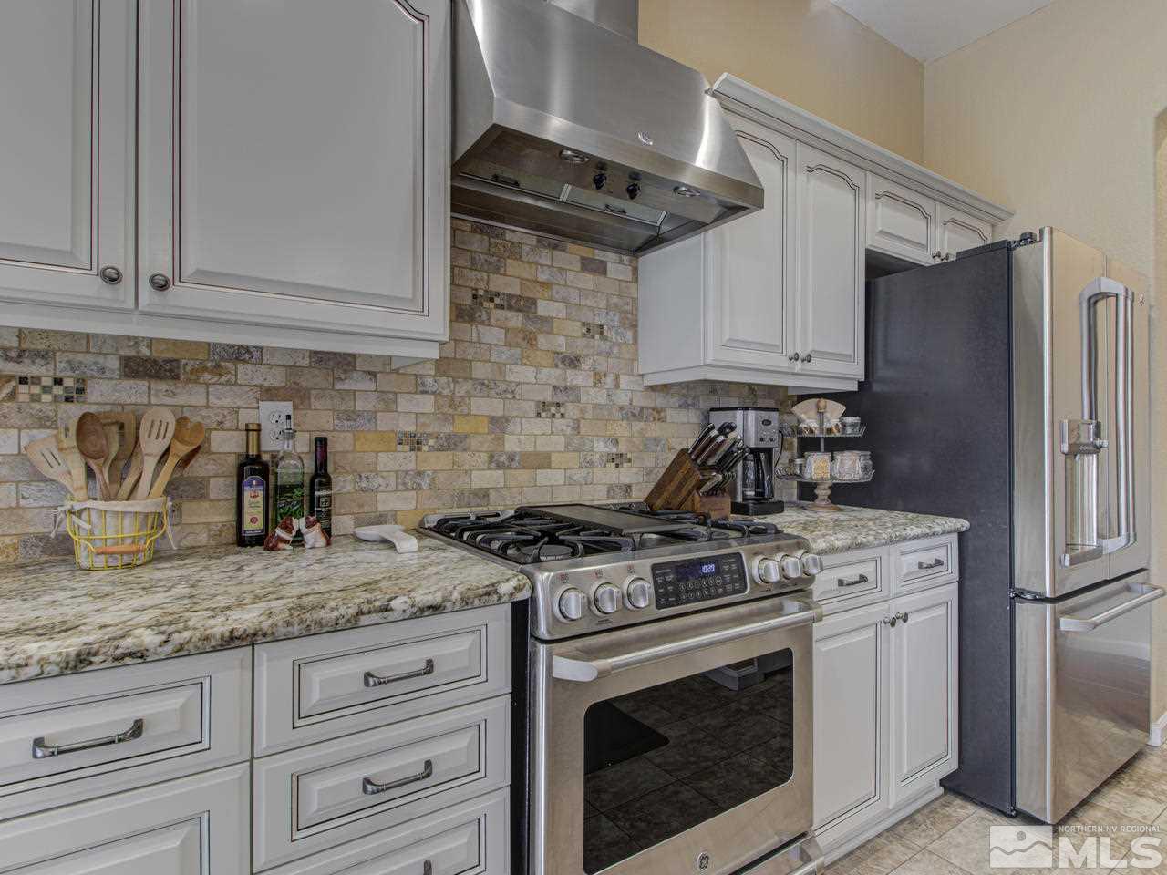1870 Beringer Way Reno, NV 89521 - Photo 8 of 25 a kitchen with granite countertop cabinets stainless steel appliances and a counter space