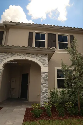 a house view with a garden space