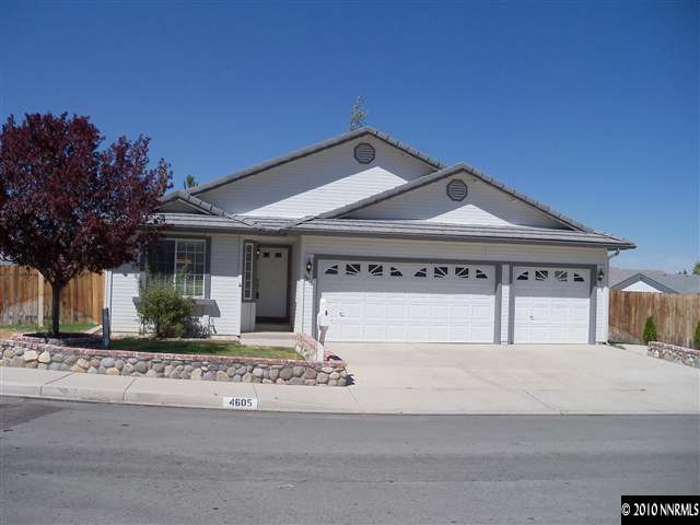 4605 Goodwin Road Sparks, NV 89436 - Photo 1 of 13 a front view of a house with a garden and plants