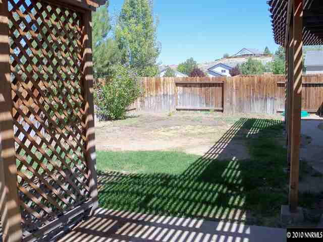 4605 Goodwin Road Sparks, NV 89436 - Photo 11 of 13 a view of a backyard of the house
