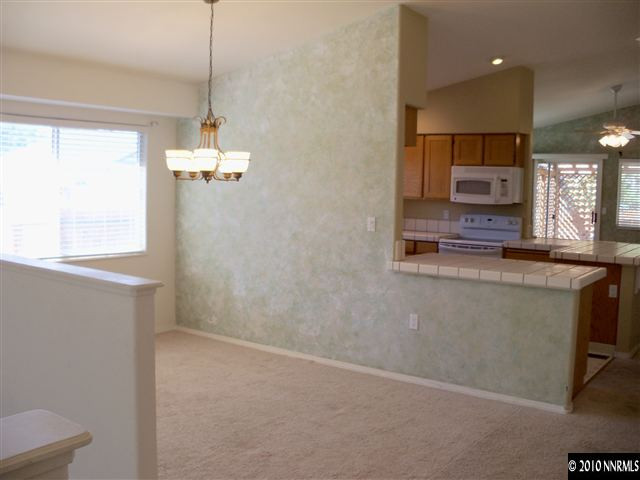4605 Goodwin Road Sparks, NV 89436 - Photo 4 of 13 a view of a kitchen from the hallway