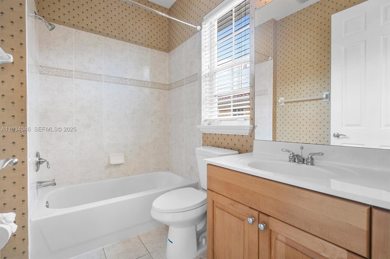 888 University Boulevard Jupiter, FL 33458 - Photo 27 of 41 a bathroom with a sink a toilet and a bathtub
