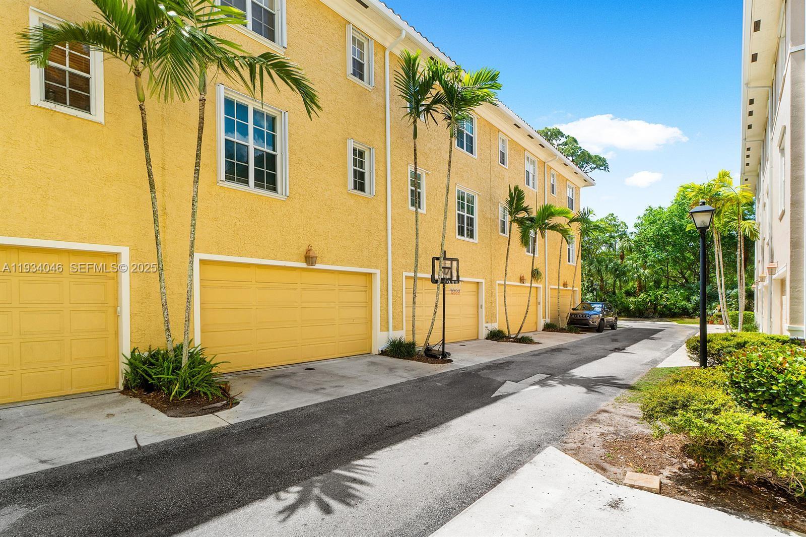 888 University Boulevard Jupiter, FL 33458 - Photo 40 of 41 a front view of a house with a yard