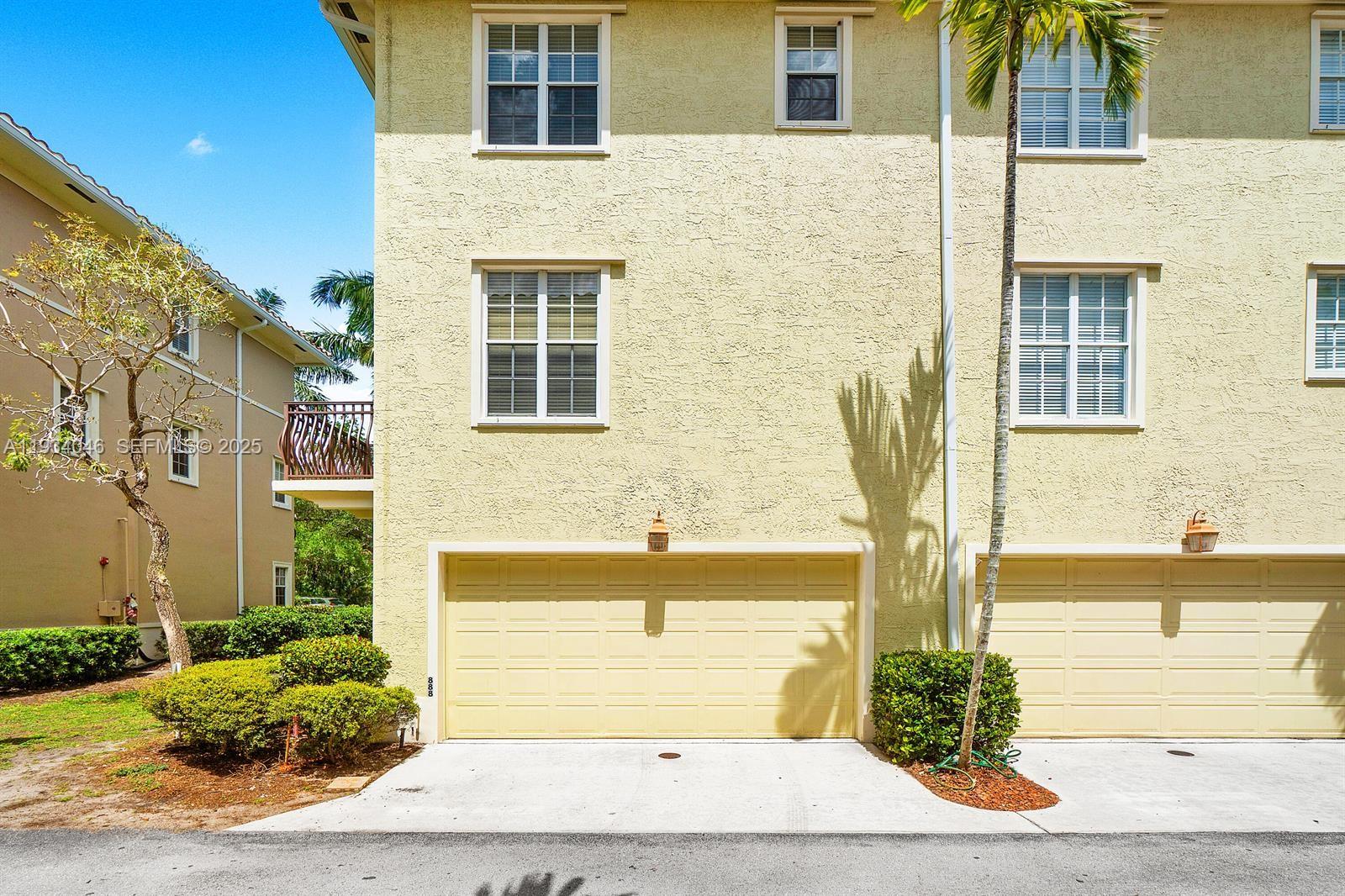 888 University Boulevard Jupiter, FL 33458 - Photo 41 of 41 a front view of a house with a yard