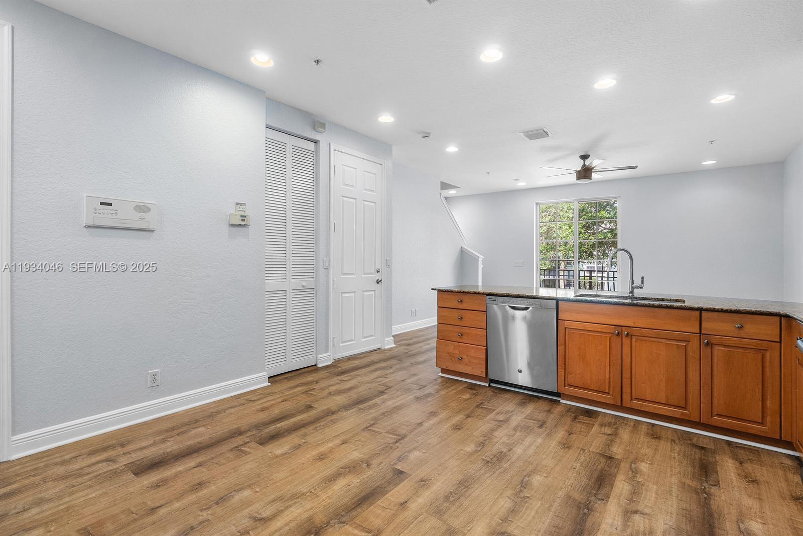 888 University Boulevard Jupiter, FL 33458 - Photo 10 of 41 an empty room with wooden floor and window
