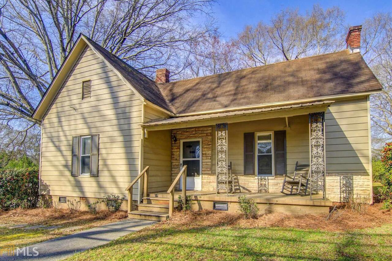 a view of house with yard