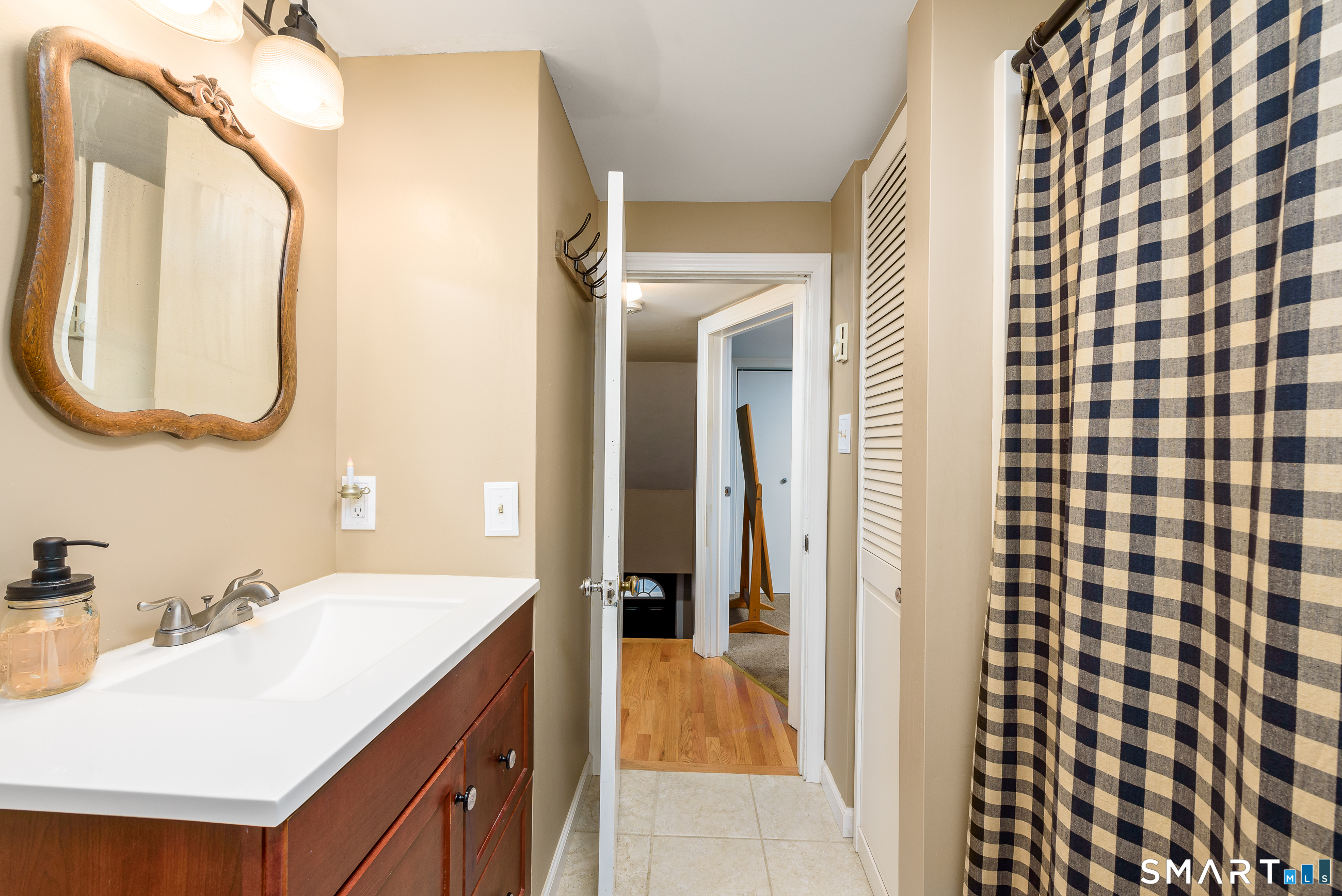 214 Thayer Road Haddam, CT 06441 - Photo 17 of 39 a en suite bathroom with a sink and a mirror