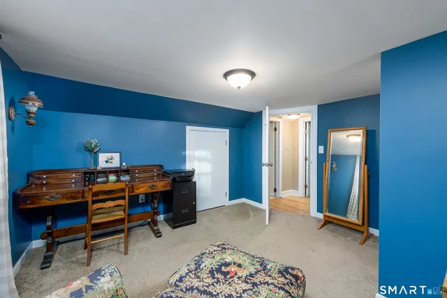 a view of a workspace with furniture