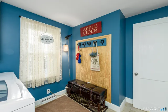 a view of a livingroom with furniture and windows