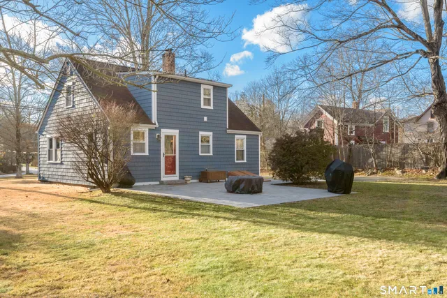 a house view with swimming pool in front of house