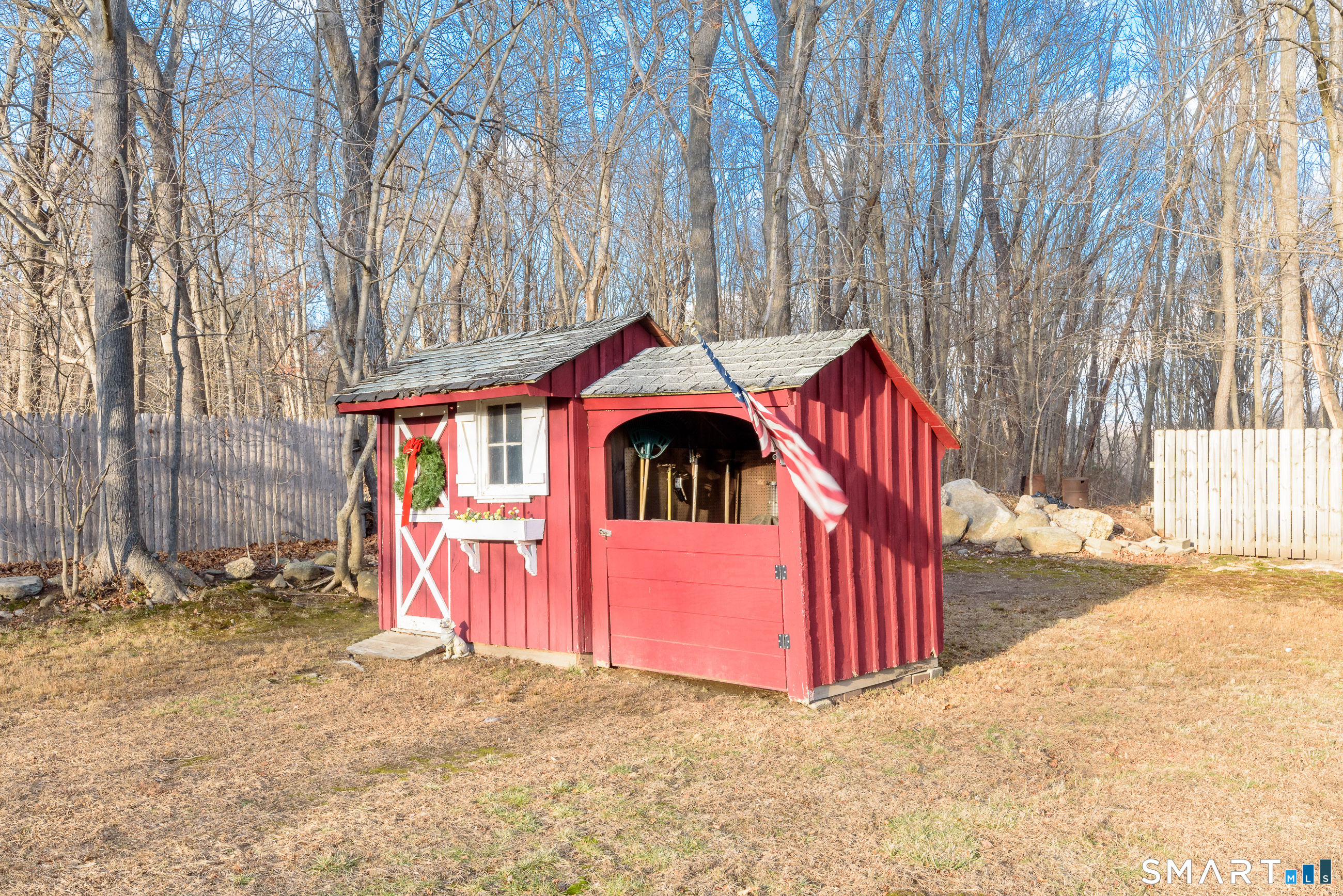214 Thayer Road Haddam, CT 06441 - Photo 31 of 39 a view of a house with a yard and wooden fence