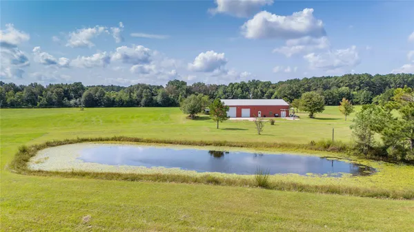 a view of a swimming pool and a yard