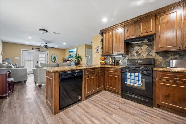 a kitchen with a stove and a sink