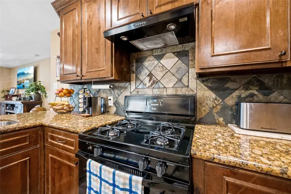 a bedroom with a bed and a mirror on the dresser