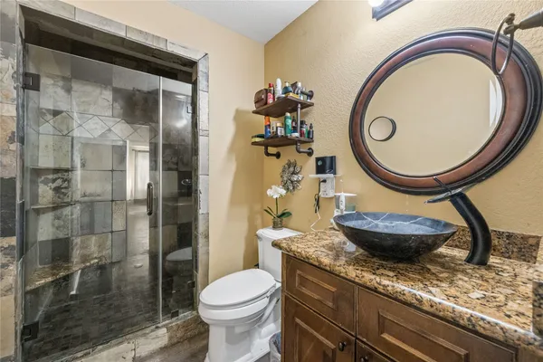 a view of kitchen with stainless steel appliances cabinets and wooden floor
