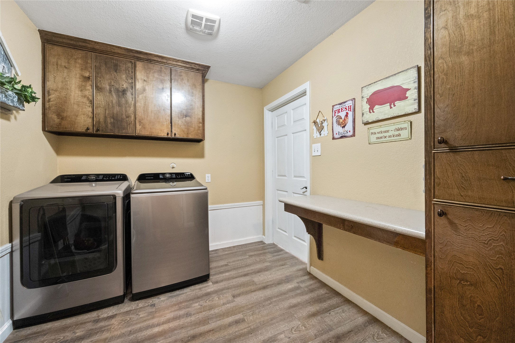 501 County Road 2276 Cleveland, TX 77327 - Photo 22 of 49 a view of kitchen with stainless steel appliances cabinets and wooden floor