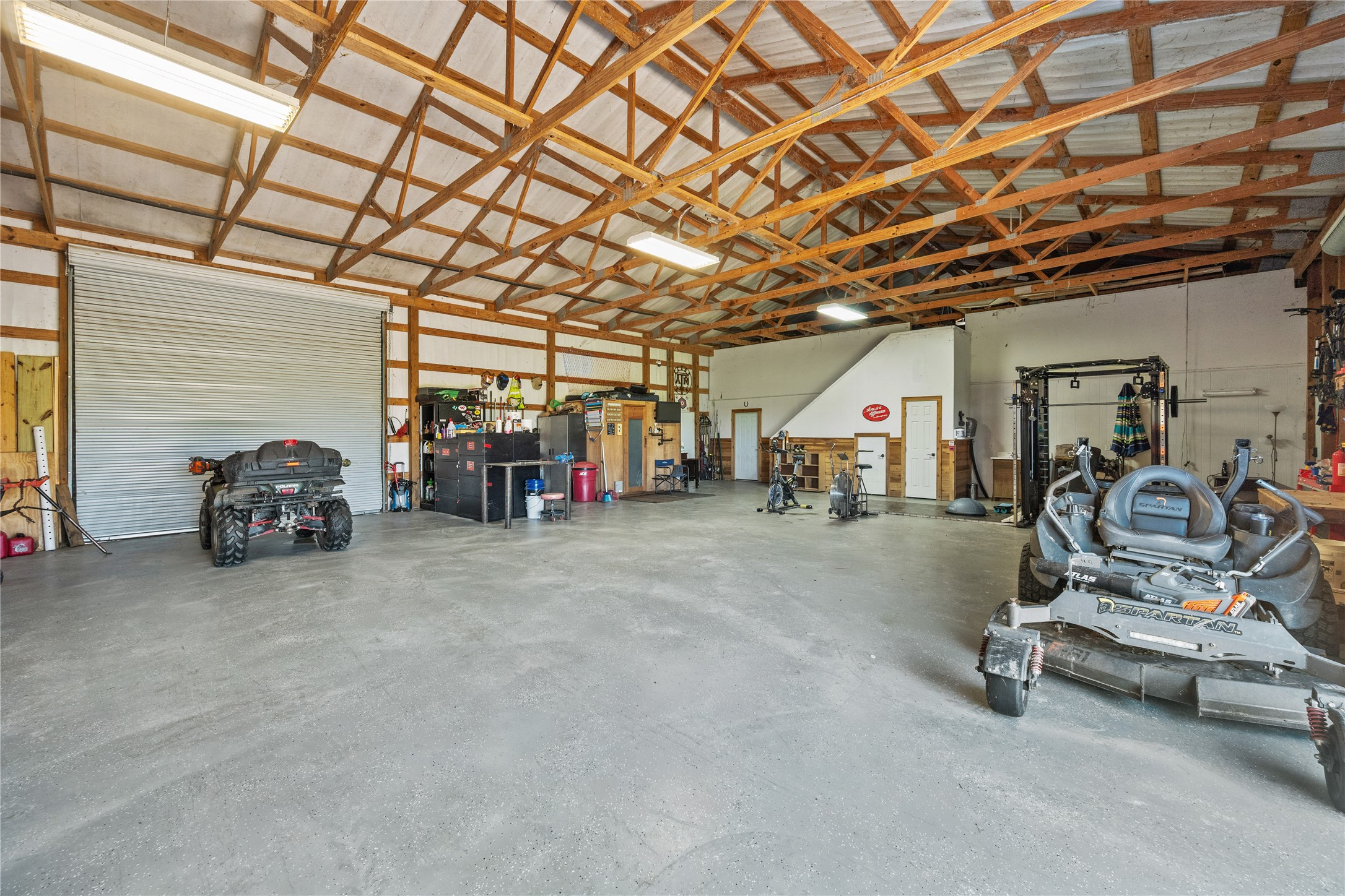501 County Road 2276 Cleveland, TX 77327 - Photo 24 of 49 a view of a room with gym equipment