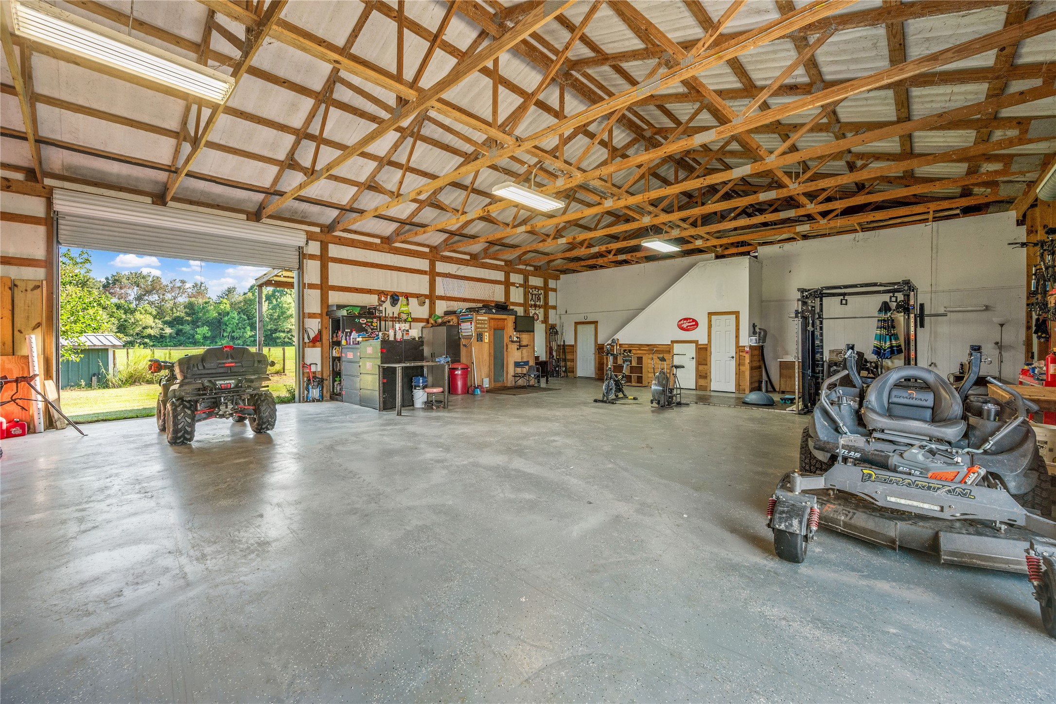 501 County Road 2276 Cleveland, TX 77327 - Photo 25 of 49 a view of a room with gym equipment