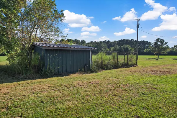 a view of a big yard with a house in back