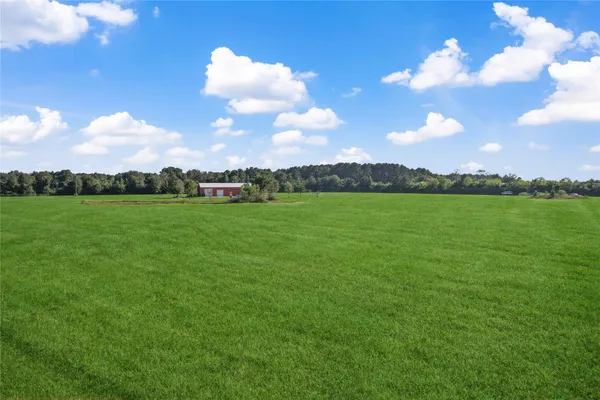 a view of a lake with a houses in the background