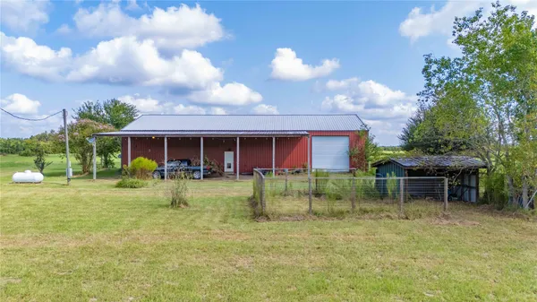a view of a lake with houses in the back