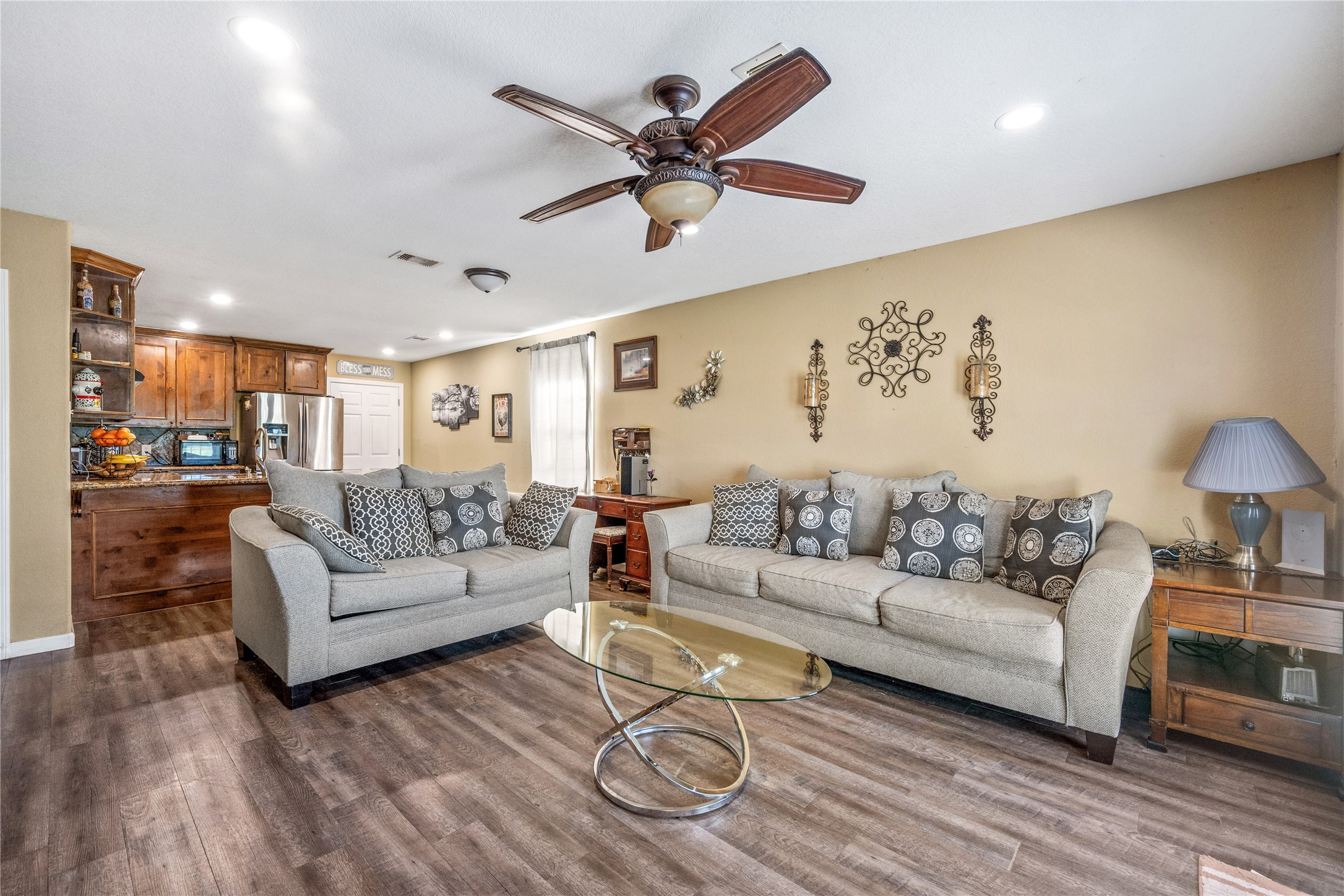 501 County Road 2276 Cleveland, TX 77327 - Photo 10 of 49 a living room with furniture and a wooden floor