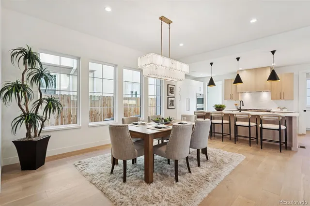 a view of a dining room with furniture window and natural light