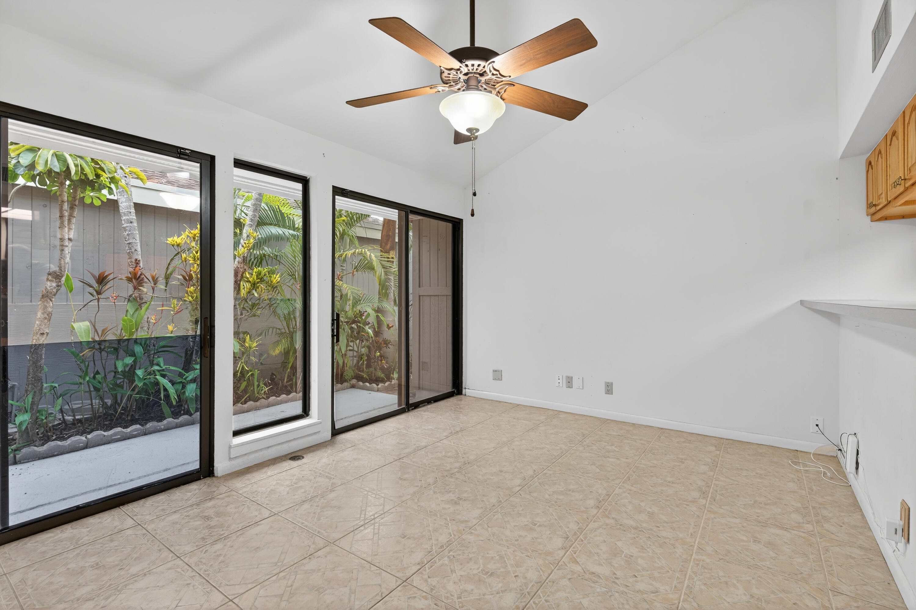 17145 Bay Street Jupiter, FL 33477 - Photo 11 of 43 a view of an empty room with a window