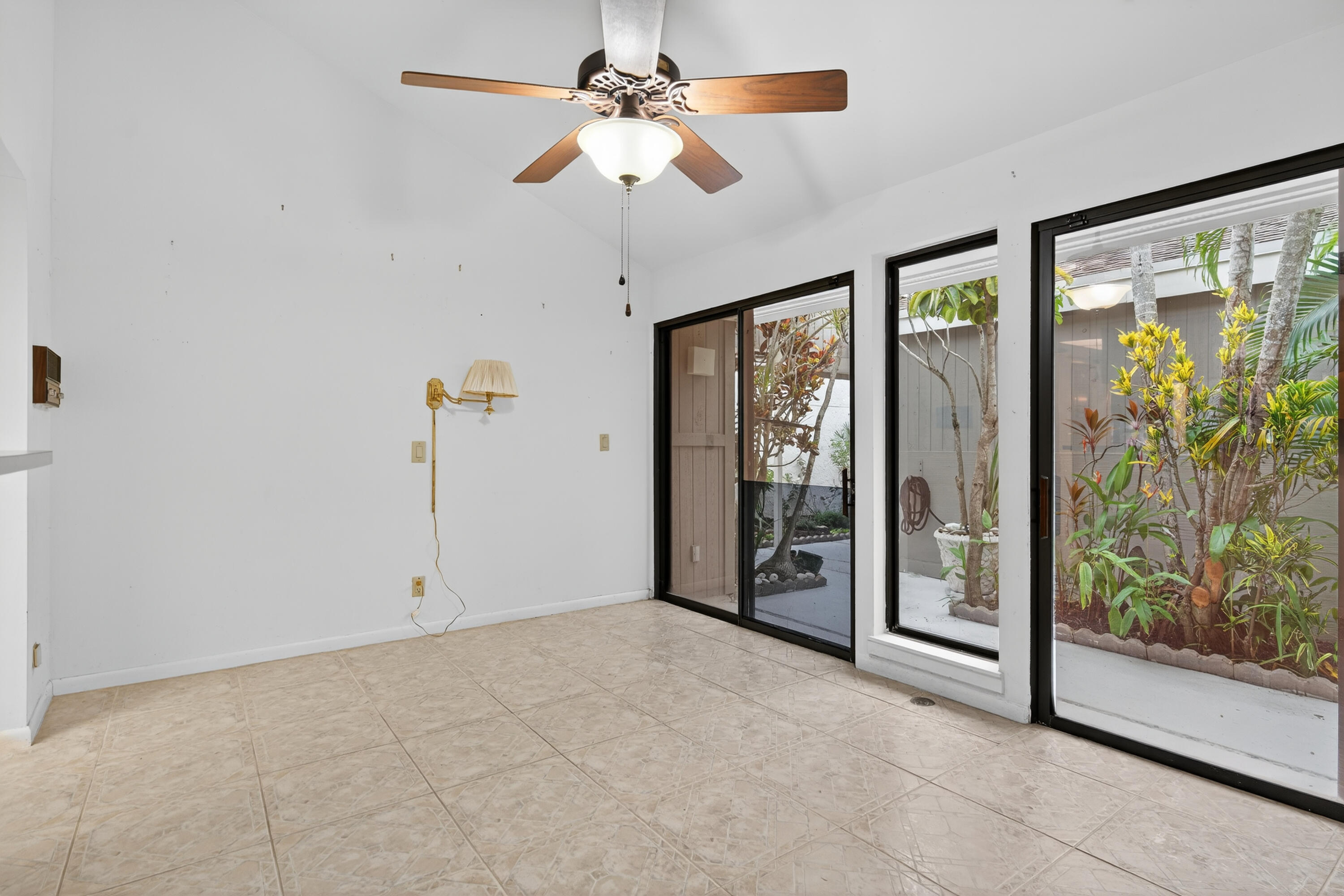 17145 Bay Street Jupiter, FL 33477 - Photo 13 of 43 a view of an empty room with window