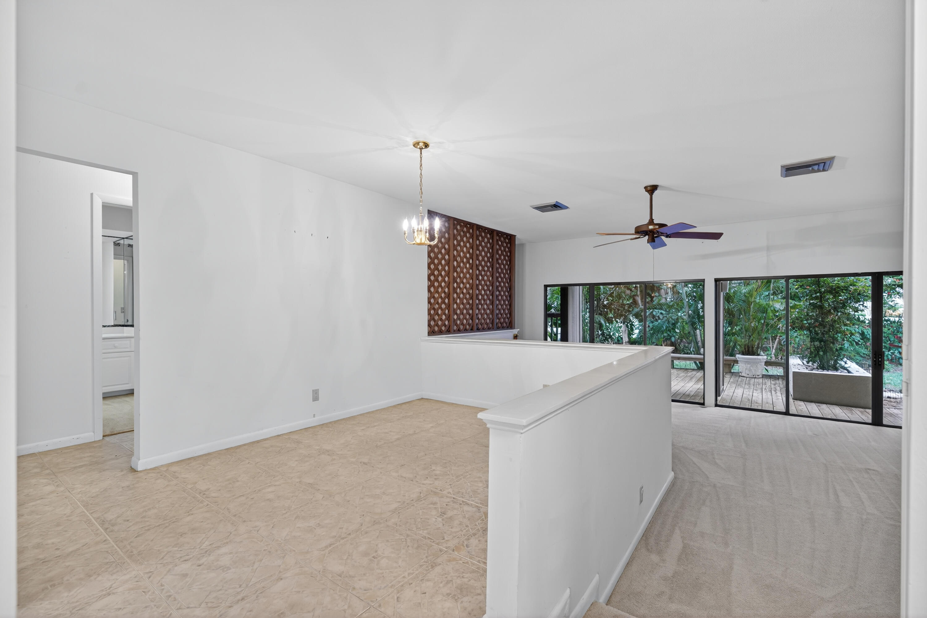 17145 Bay Street Jupiter, FL 33477 - Photo 14 of 43 a view of a kitchen with a sink and a window