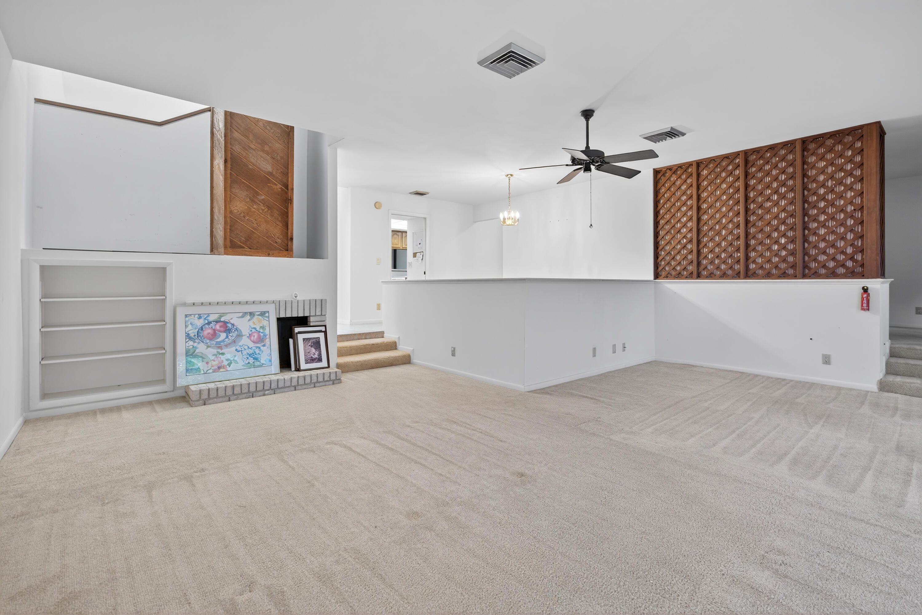 17145 Bay Street Jupiter, FL 33477 - Photo 17 of 43 an empty room with windows and ceiling fan