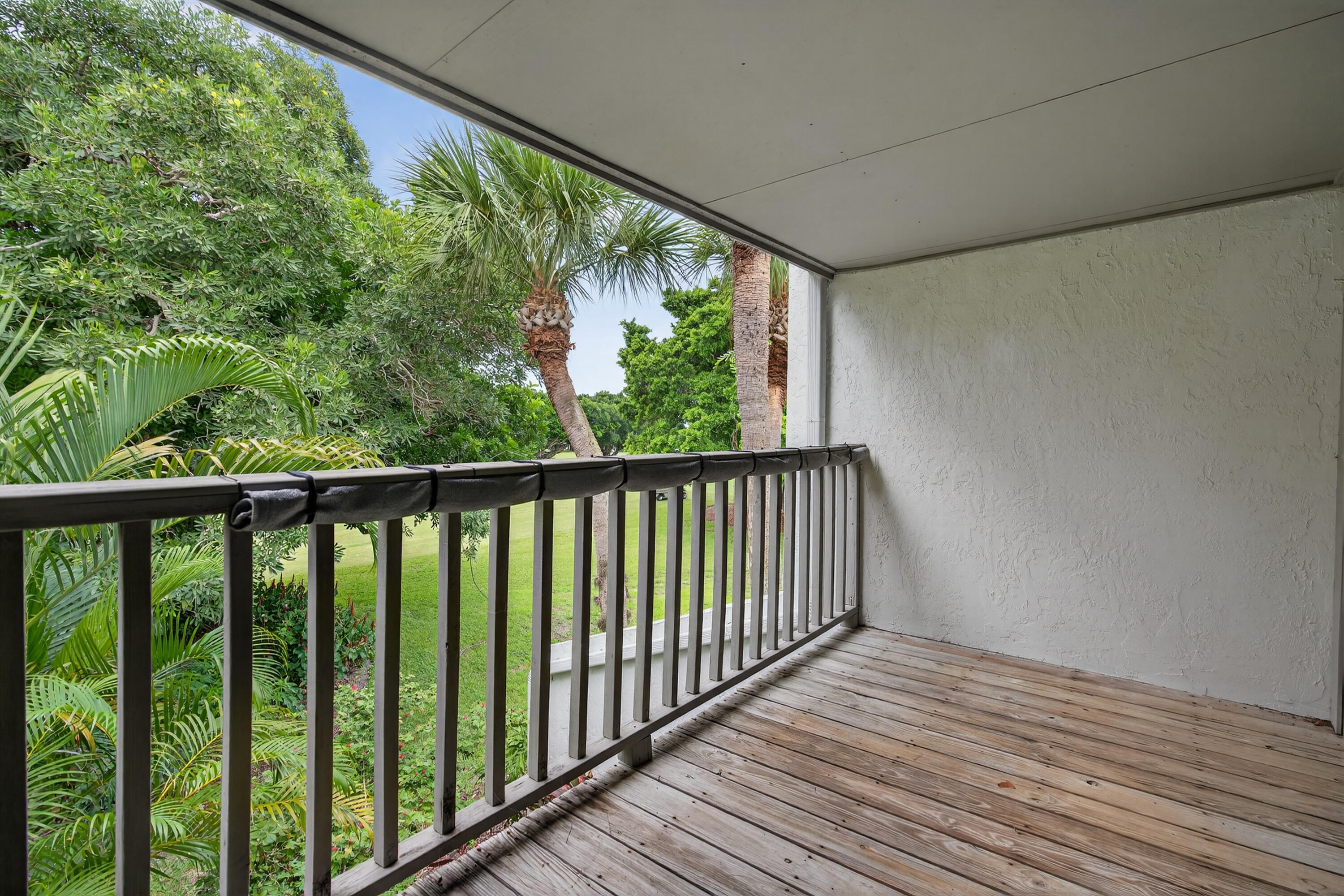 17145 Bay Street Jupiter, FL 33477 - Photo 32 of 43 a view of a balcony with wooden floor