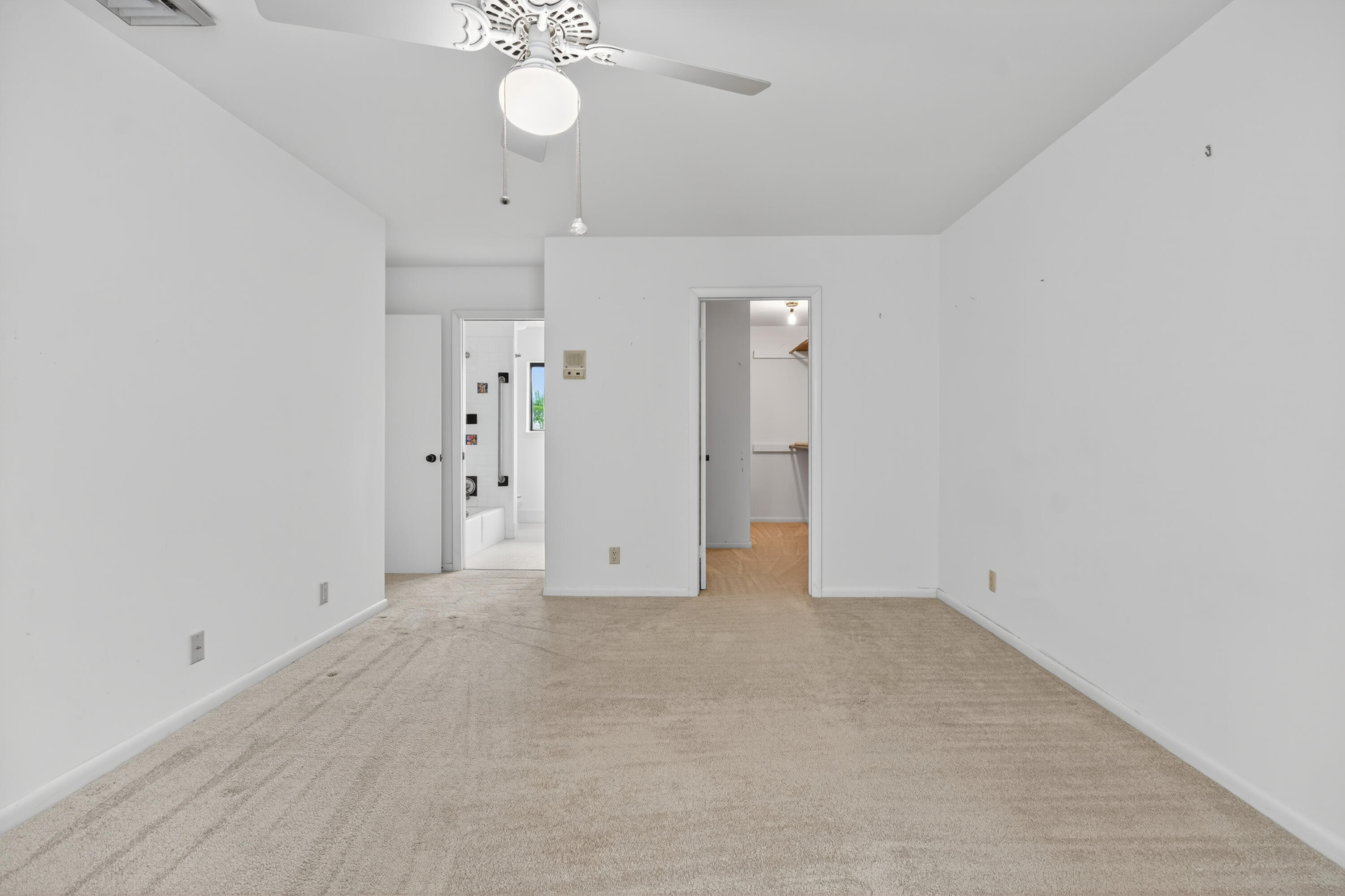 17145 Bay Street Jupiter, FL 33477 - Photo 37 of 43 an empty room with a bathroom and a shower