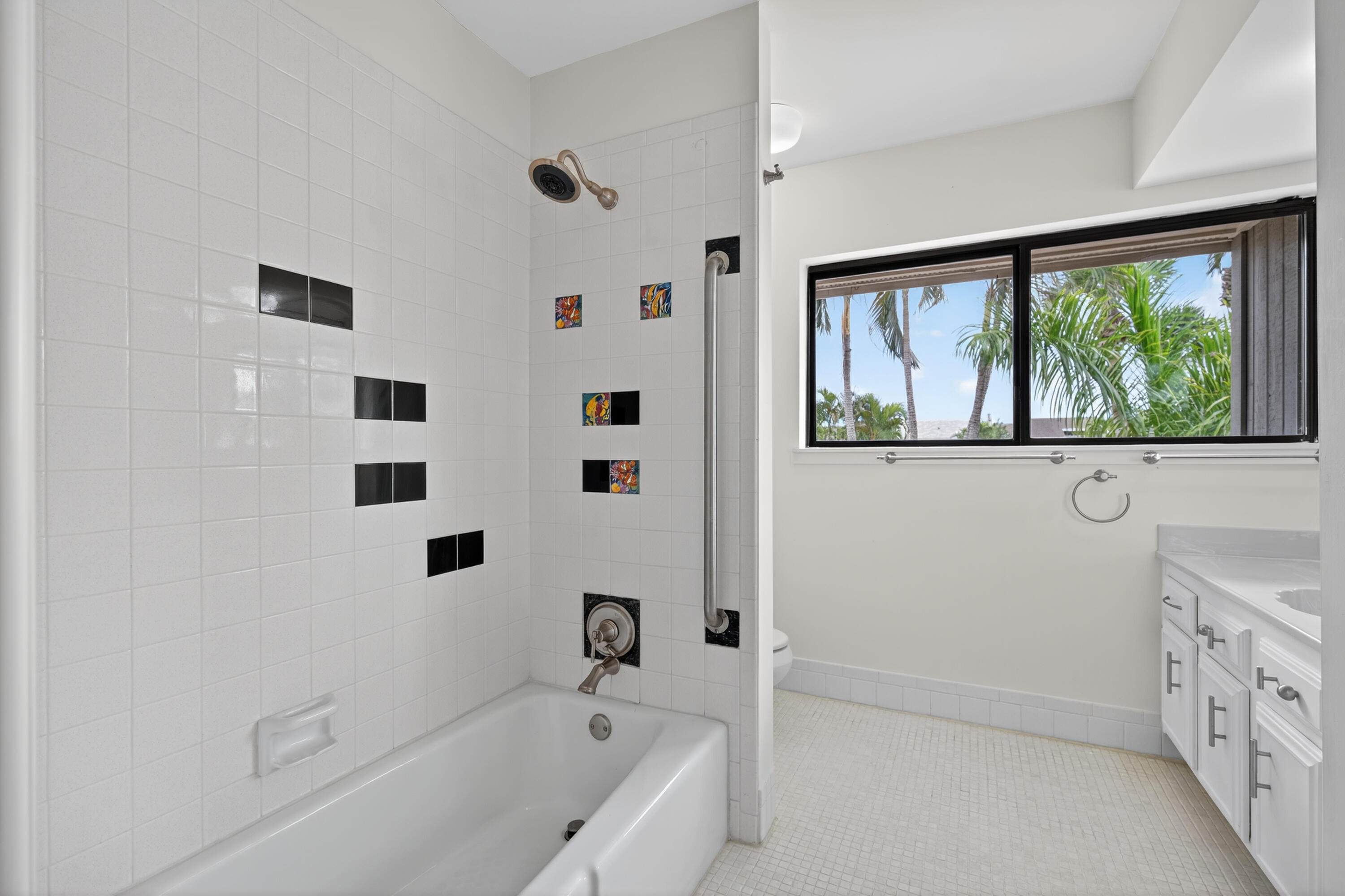 17145 Bay Street Jupiter, FL 33477 - Photo 40 of 43 a bathroom with a bathtub and a shower