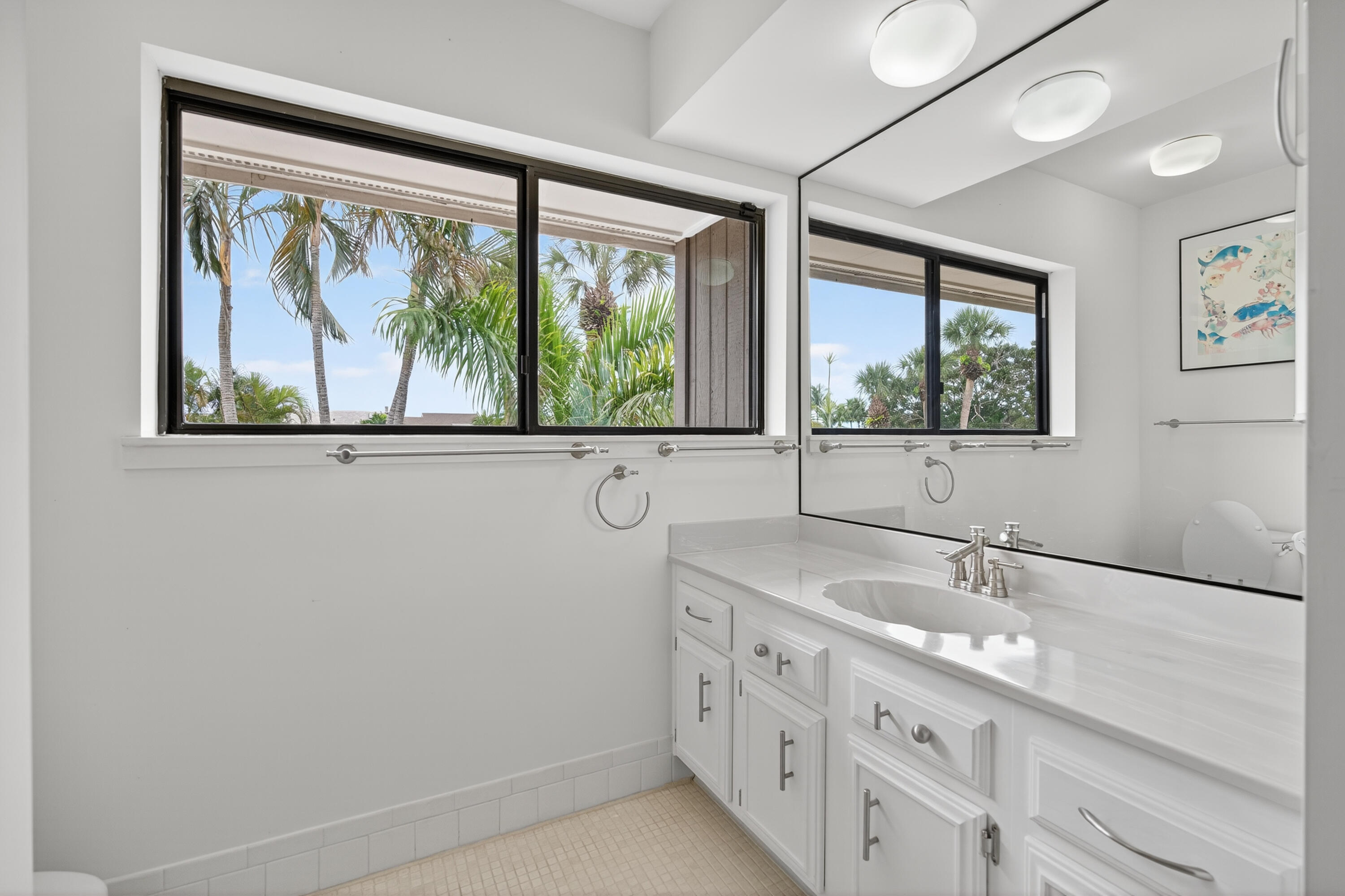 17145 Bay Street Jupiter, FL 33477 - Photo 41 of 43 a bathroom with a sink and a window