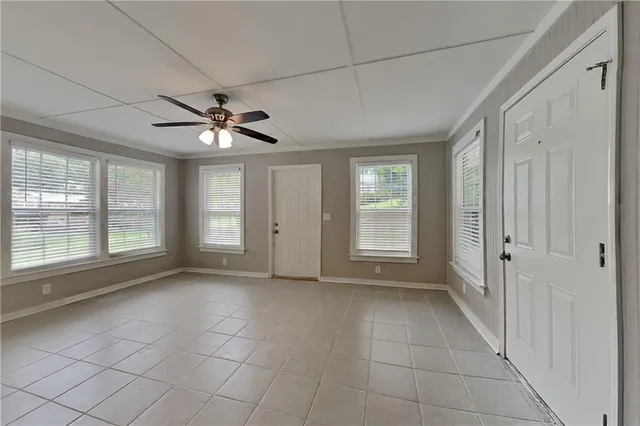 a view of an empty room with a window
