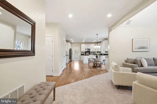 a kitchen with stainless steel appliances kitchen island granite countertop a sink and cabinets