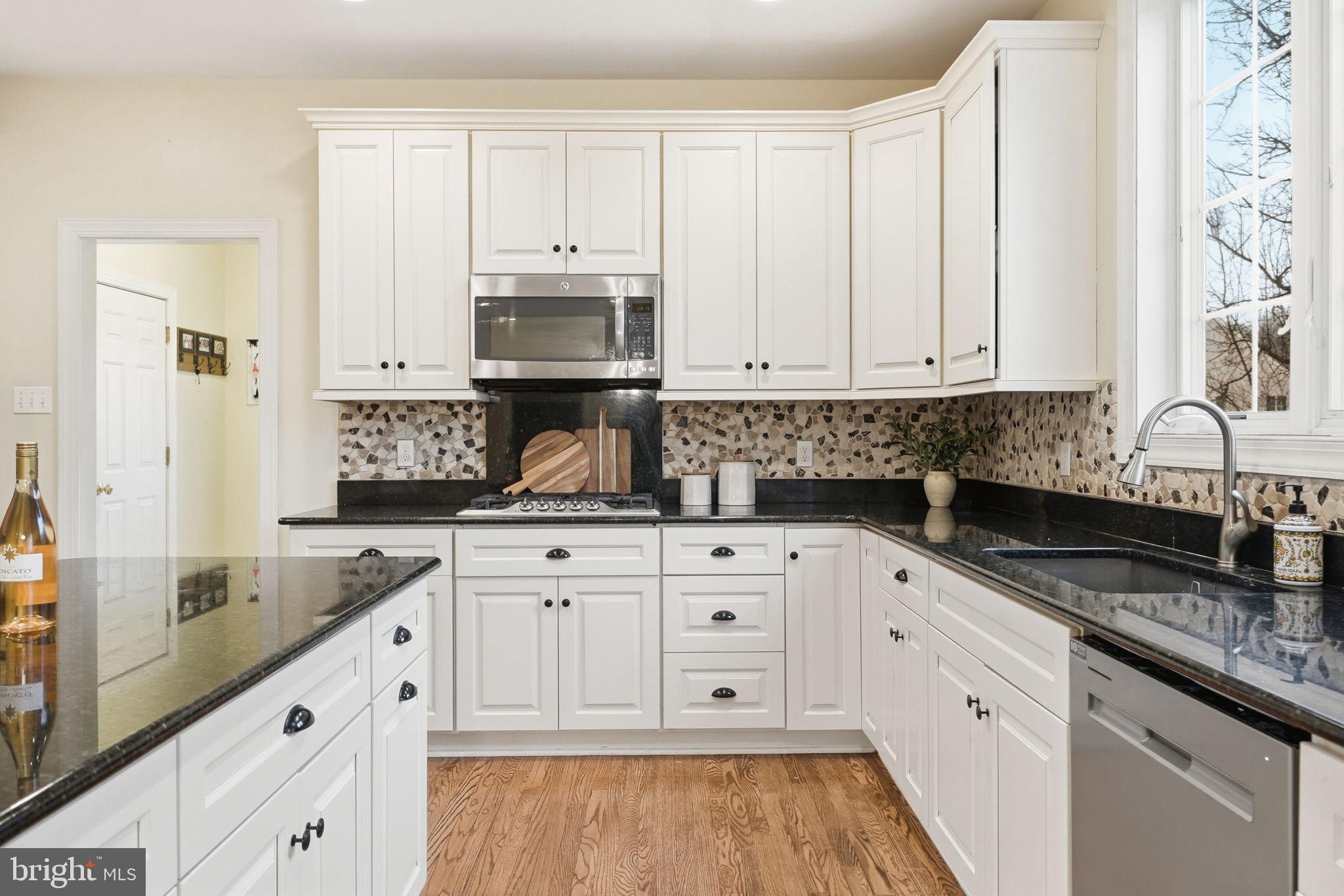 22 Springlea Lane Chester Springs, PA 19425 - Photo 19 of 80 a kitchen with stainless steel appliances granite countertop a sink and cabinets